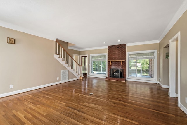 unfurnished living room featuring a fireplace, dark hardwood / wood-style floors, and ornamental molding