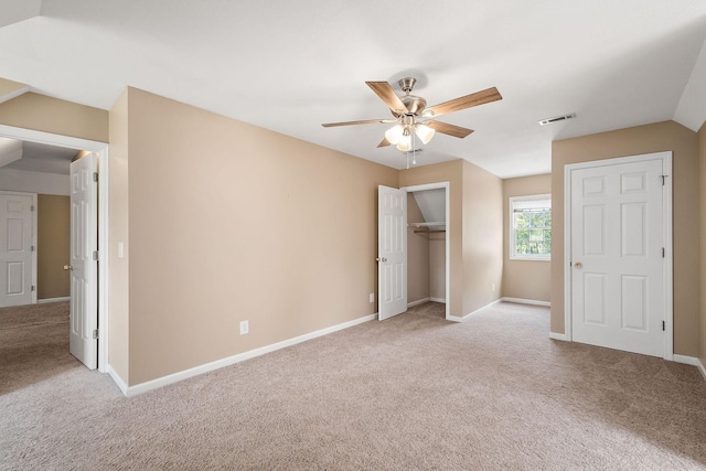 unfurnished bedroom featuring ceiling fan and light carpet