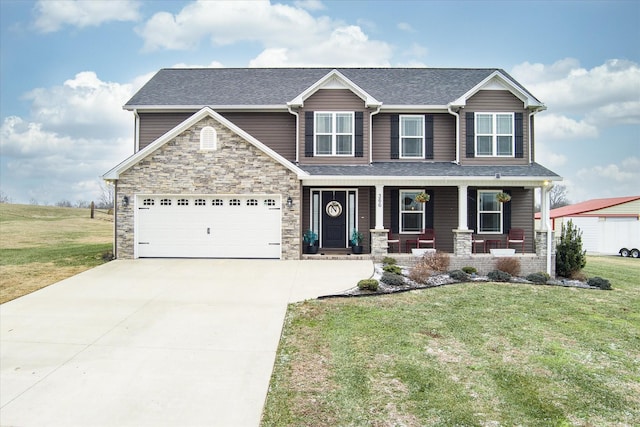 craftsman-style home with a front yard, a porch, and a garage