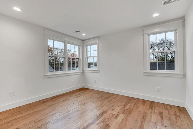 spare room with light wood-type flooring