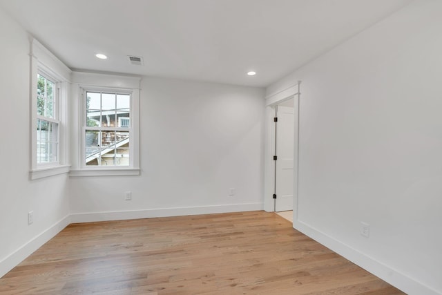 unfurnished room featuring light hardwood / wood-style flooring