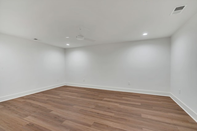 spare room with light hardwood / wood-style floors and ceiling fan