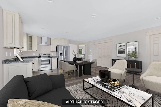 living room featuring hardwood / wood-style floors and sink