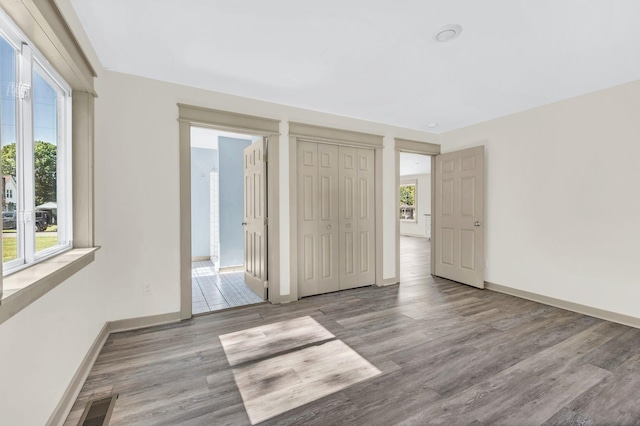 unfurnished bedroom with light hardwood / wood-style floors