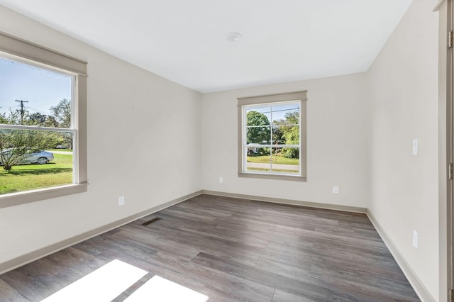 spare room featuring hardwood / wood-style floors