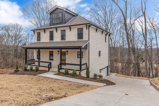 view of front of house featuring a garage and covered porch