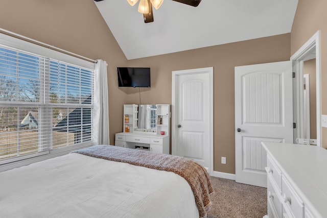 carpeted bedroom featuring ceiling fan and lofted ceiling