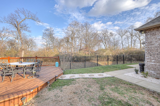 view of yard with a wooden deck