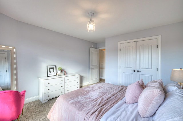 carpeted bedroom featuring a closet