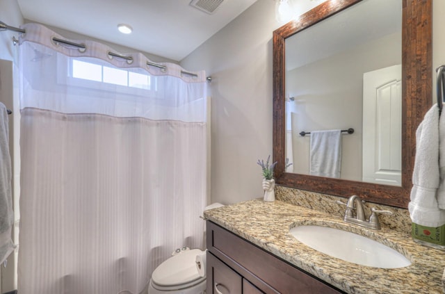 full bathroom featuring vanity, shower / bathtub combination with curtain, and toilet