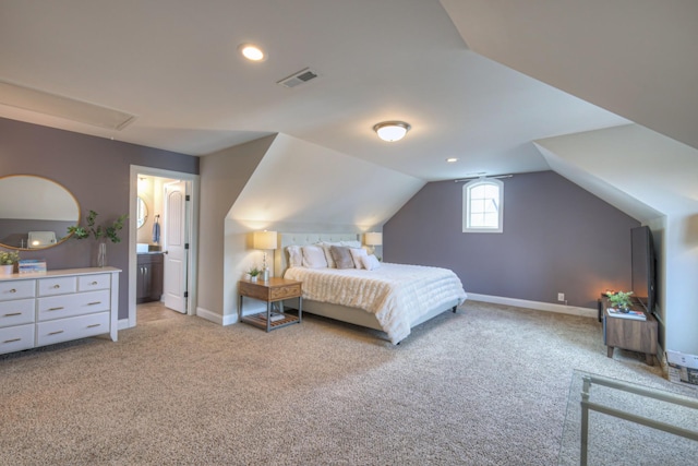 carpeted bedroom with vaulted ceiling