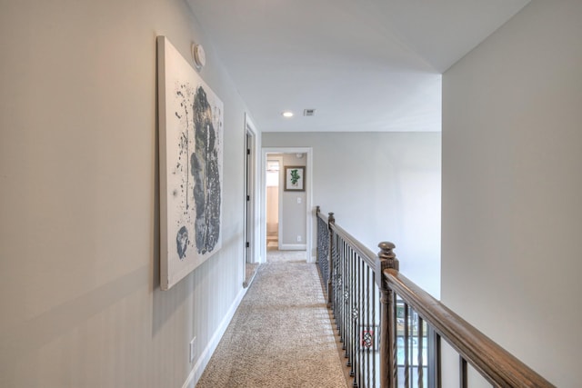 hallway with light carpet