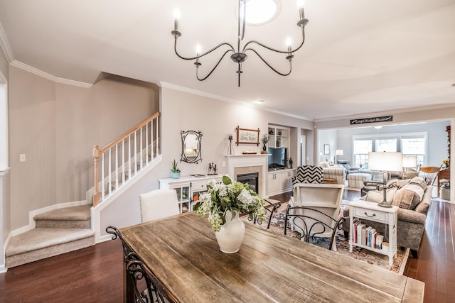 dining room with a notable chandelier, dark hardwood / wood-style floors, and ornamental molding