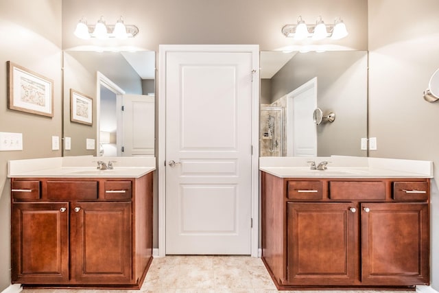 bathroom with vanity and a shower with shower door