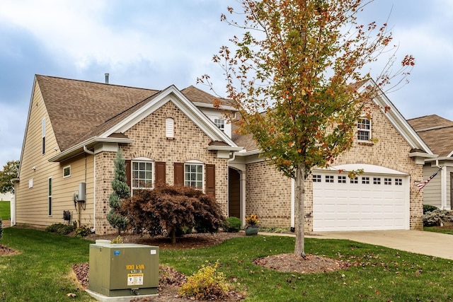 view of front facade featuring a front yard and a garage