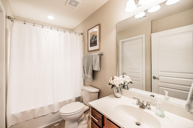 full bathroom featuring vanity, toilet, and shower / bathtub combination with curtain