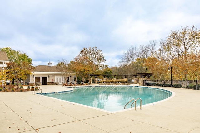 view of swimming pool with a patio