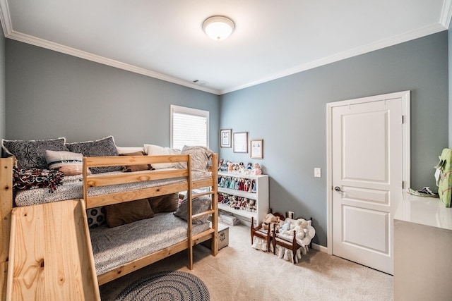 carpeted bedroom with ornamental molding