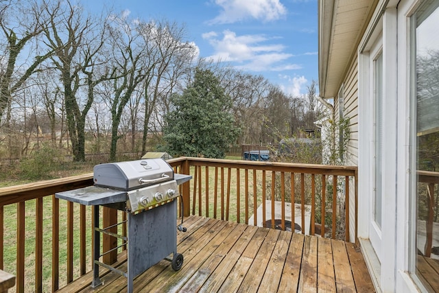 wooden terrace featuring grilling area