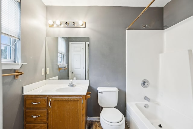 full bathroom with vanity, shower / bathtub combination, and toilet