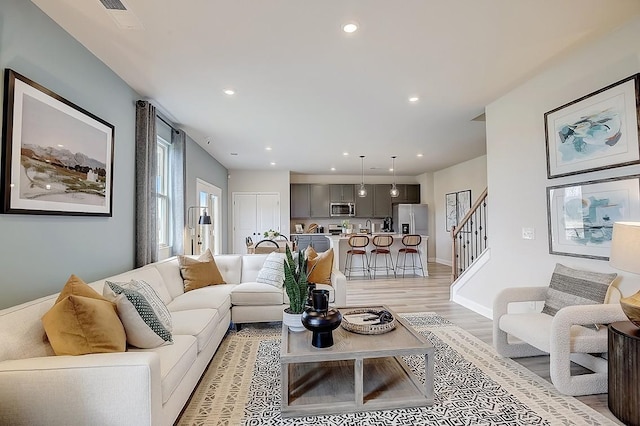 living room with light hardwood / wood-style flooring