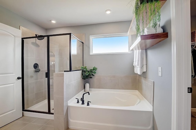 bathroom featuring separate shower and tub and tile patterned flooring