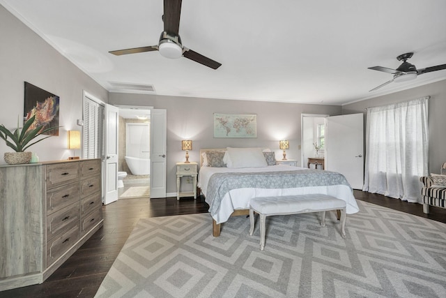 bedroom with ornamental molding, ceiling fan, dark wood-type flooring, connected bathroom, and a closet