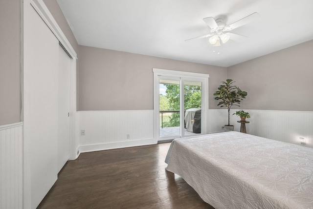 bedroom featuring access to exterior, ceiling fan, a closet, and dark wood-type flooring