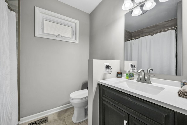 bathroom featuring tile patterned floors, vanity, toilet, and curtained shower