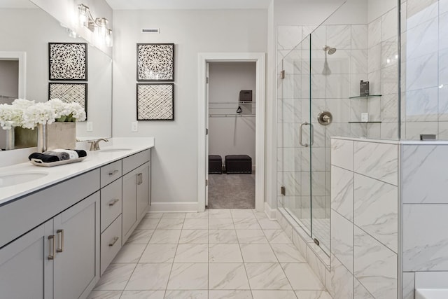 bathroom featuring vanity and a shower with shower door