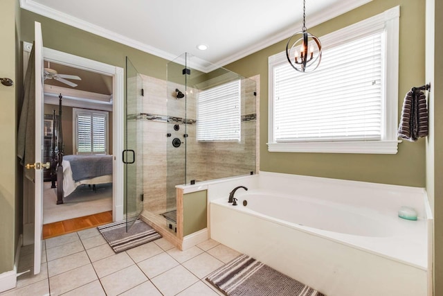 bathroom featuring tile patterned flooring, crown molding, ceiling fan with notable chandelier, and plus walk in shower