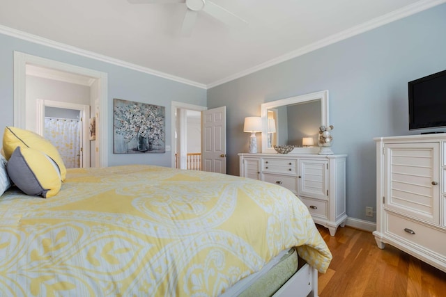 bedroom featuring ceiling fan, light wood-type flooring, connected bathroom, and crown molding