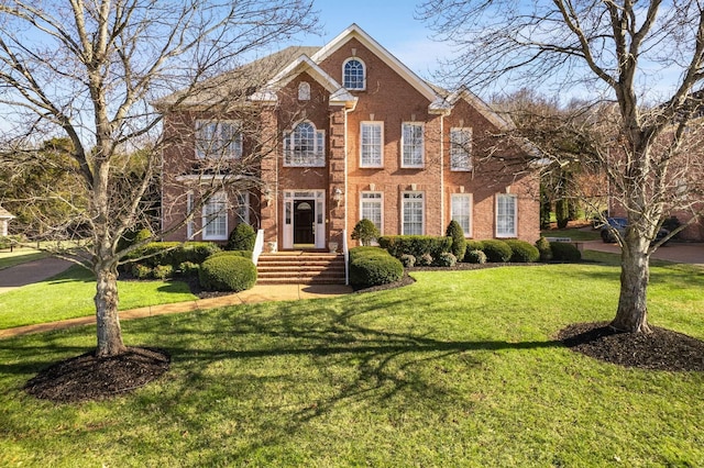 colonial inspired home with a front yard