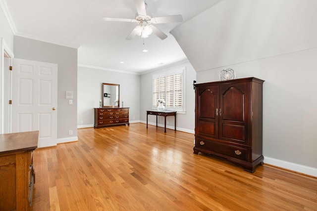 unfurnished bedroom with ceiling fan, light wood-type flooring, and crown molding