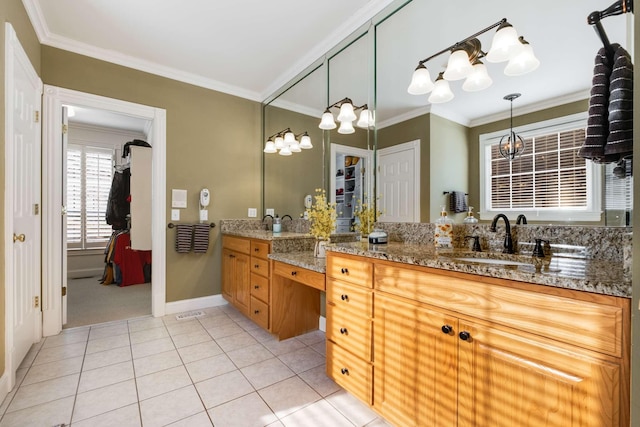 bathroom featuring tile patterned flooring, crown molding, and vanity