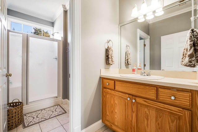 bathroom with vanity, tile patterned flooring, crown molding, and walk in shower