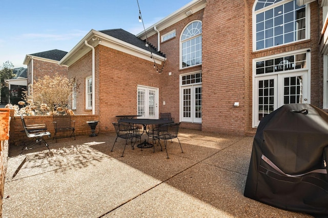 rear view of house with french doors and a patio