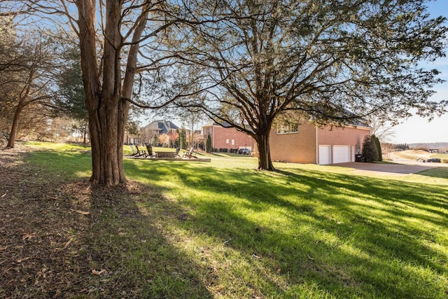 view of yard featuring a garage