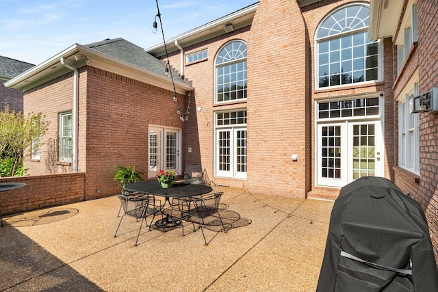 view of patio with a grill and french doors