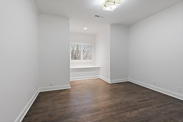 unfurnished room with dark hardwood / wood-style flooring and ornamental molding