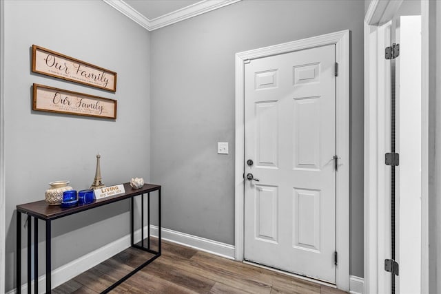 foyer with wood-type flooring and ornamental molding