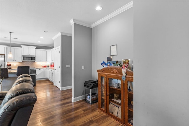 living room with dark hardwood / wood-style flooring and crown molding