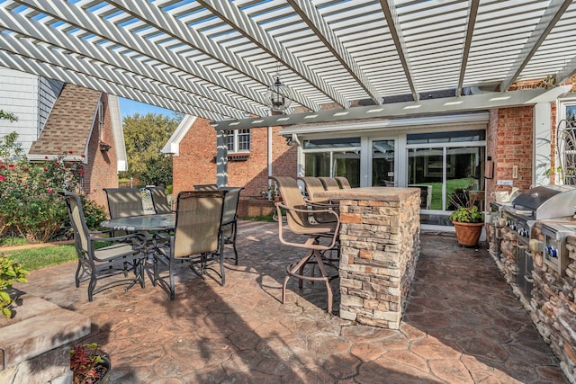 view of patio / terrace with a grill, a pergola, and an outdoor bar