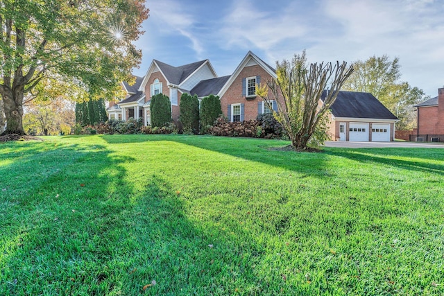 view of front of home featuring a garage and a front lawn