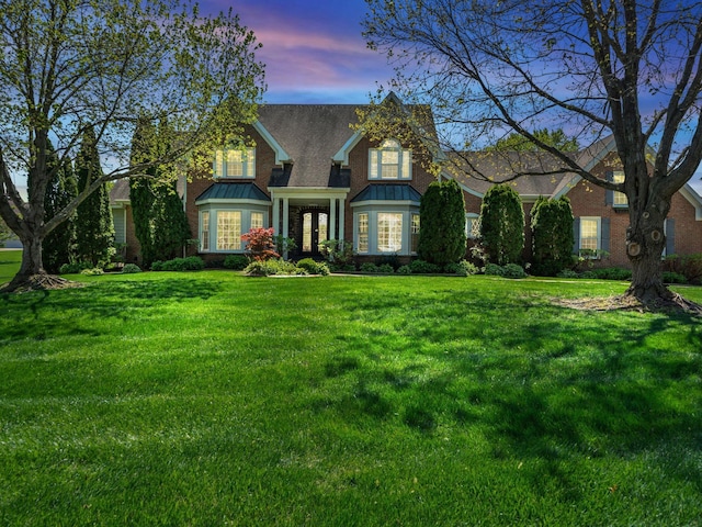 409 Savannah Trace Dr, Clarksville, TN 37043 - traditional home with a front yard, french doors, and a standing seam roof