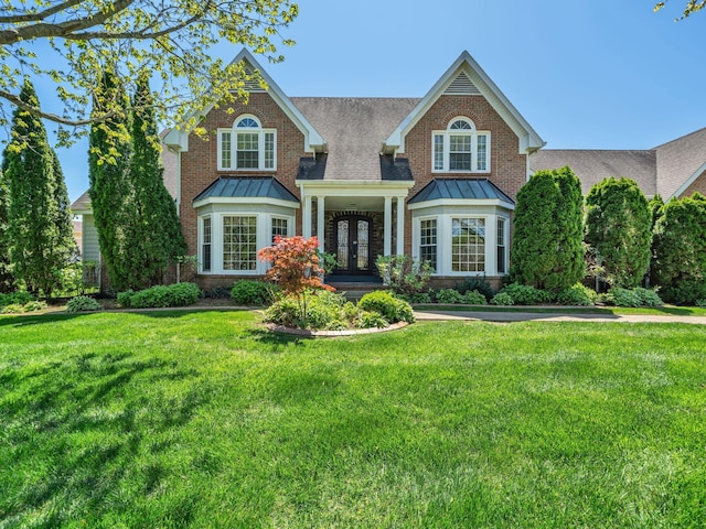 409 Savannah Trace Dr, Clarksville, TN 37043 - view of front of house featuring a standing seam roof, metal roof, and french doors