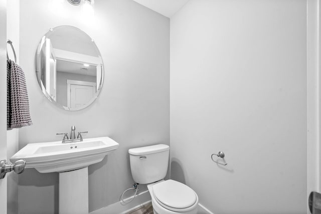 bathroom featuring toilet and sink