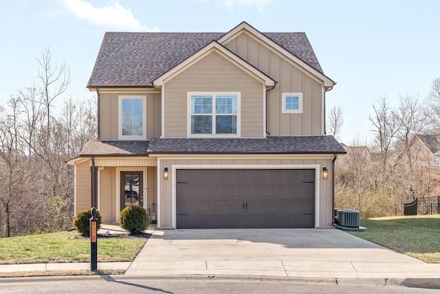 view of front facade featuring central AC, a garage, and a front lawn