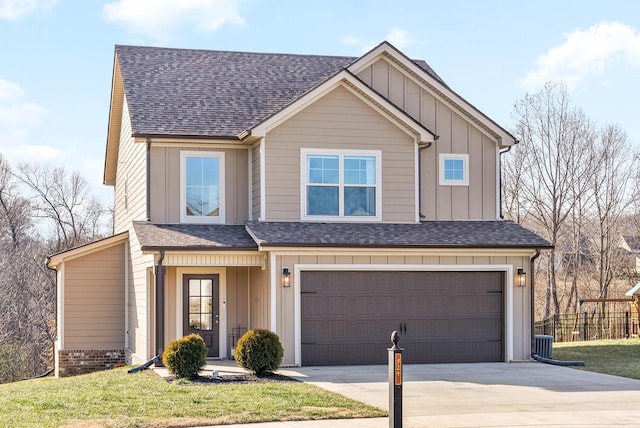 view of front of house with central air condition unit, a front lawn, and a garage