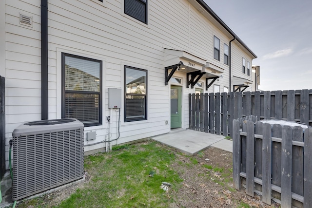 back of house featuring central AC